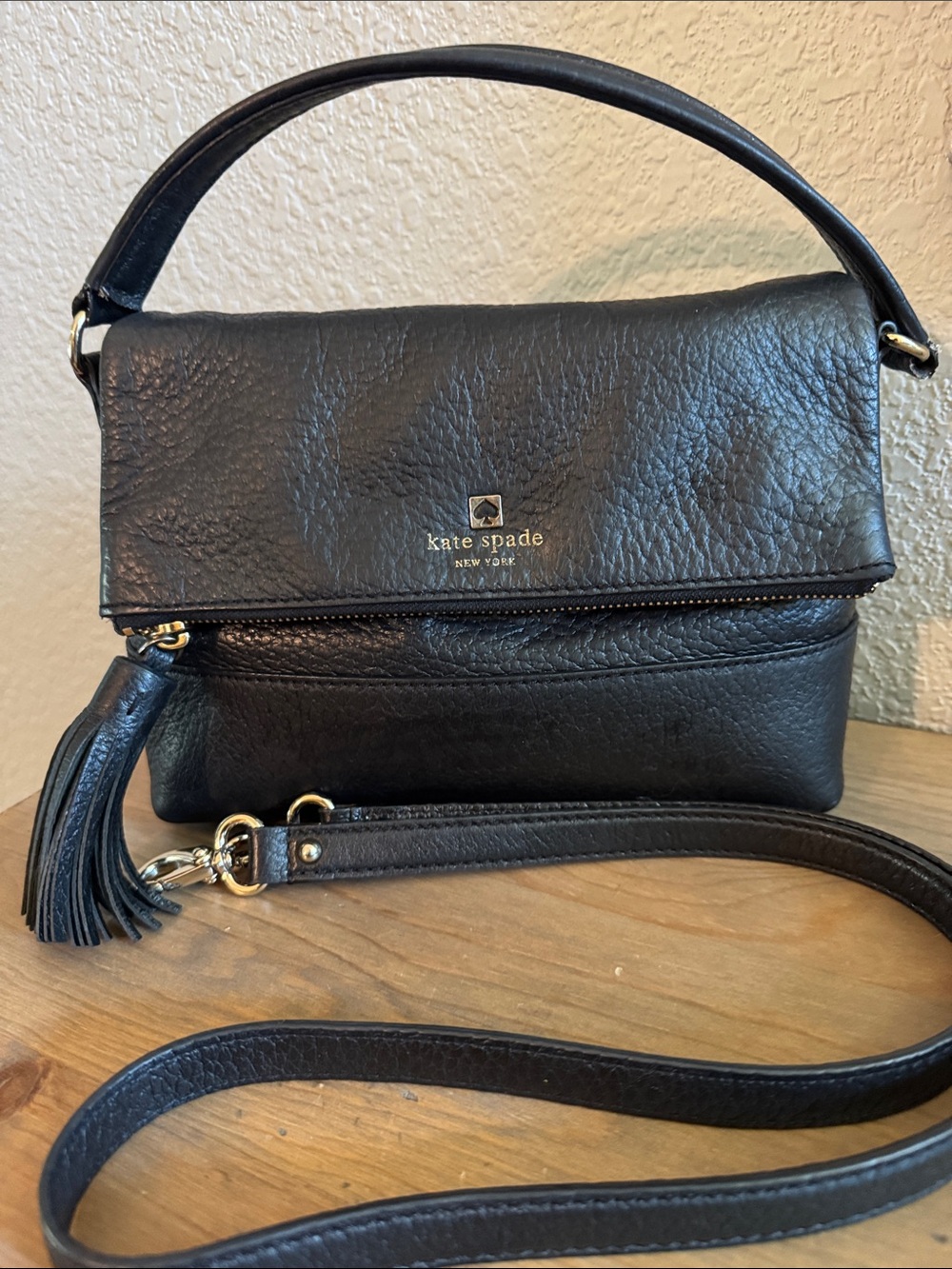 kate spade Black Leather Fold-Over Crossbody with Tassel